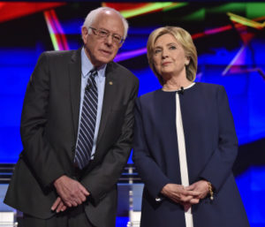 Democratic presidential candidates  Sen. Bernie Sanders, of Vermont, left, and Hillary Rodham Clinton talk before the CNN Democratic presidential debate Tuesday, Oct. 13, 2015, in Las Vegas. (AP Photo/David Becker)